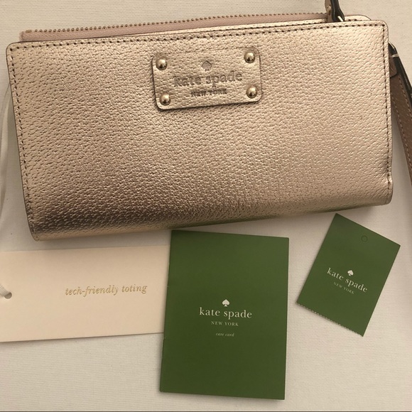 kate spade Handbags - NEW Kate Spade Rose Gold Wallet